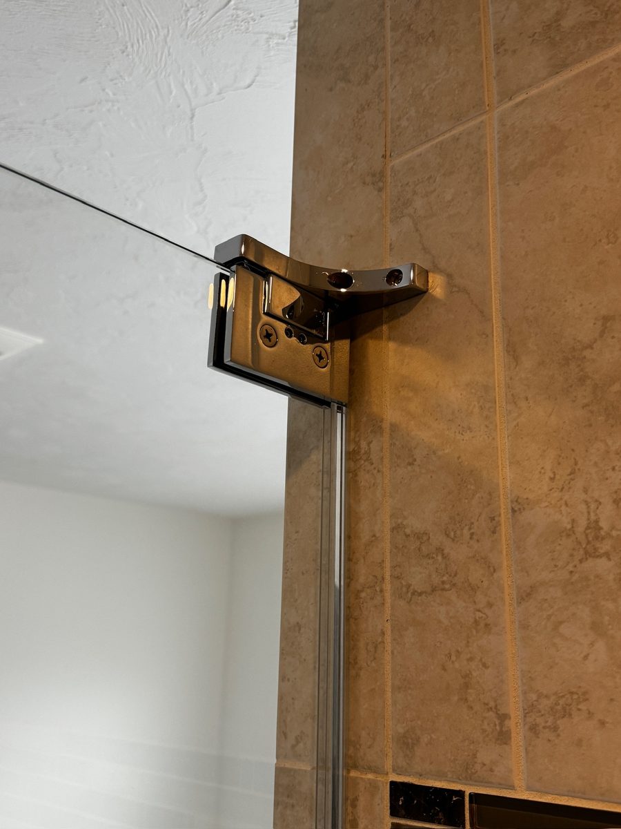 Frameless shower door installation Wellesley MA brushed nickel hardware